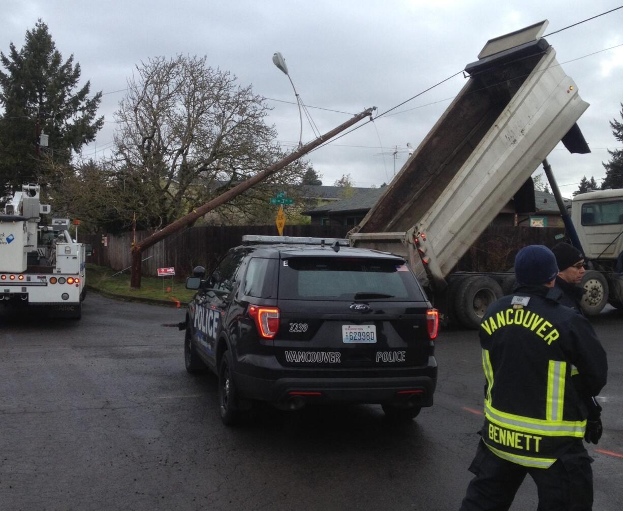 Vancouver firefighters and police responded to a downed power pole Thursday morning after a dump truck came into contact with a powerline, causing damage to the attached pole on the corner of Northeast 82nd Avenue and Northeast 7th Street.