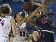 Camas's Maggie Wells (23) is fouled by Eastlake's Gina Marxen (22) during a WIAA 4A State Hardwood Classic's 2nd round basketball game at the Tacoma Dome on March 1, 2018 in Tacoma. Eastlake led Camas 27-6 at the half and went onto win 58-27.