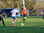 La Center forward Alec Watkins dribbles at the top of the 18-yard box in the first half of a 7-0 win over Seton Catholic on Tuesday, April 10, 2018 at La Center High School (Andy Buhler/Columbian staff). Watkins had a hattrick.