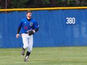 Clark College’s Chaz Lopez shags fly balls during batting practice prior a game at Kindsfather Field. Lopez is an effective pitcher, hitter and can play either outfield corner for the Penguins.