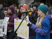 Matthea Freitag, 12, of Vancouver joins fellow students as she speaks about gun control to the crowd at Esther Short Park during the Vancouver March For Our Lives event.