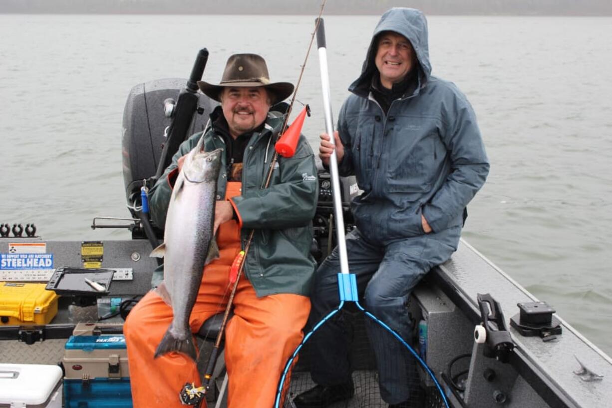 Buzz Ramsey, left, and Ron Hiller display a spring Chinook caught on a Maglip 4.5 while pre fishing the NSIA Spring Classic salmon derby.