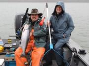 Buzz Ramsey, left, and Ron Hiller display a spring Chinook caught on a Maglip 4.5 while pre fishing the NSIA Spring Classic salmon derby.