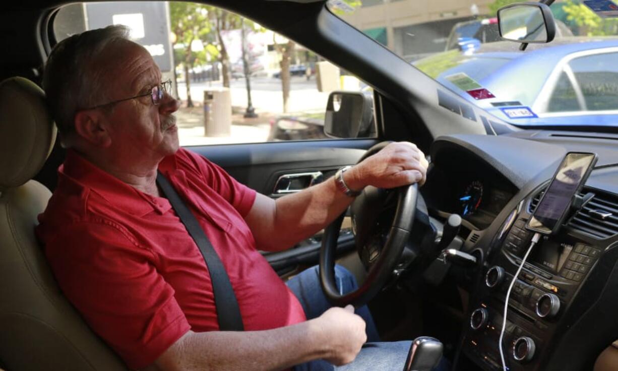 Johnny Pollard, of Haltom City, Texas, drives for Uber full time and says the job has saved him from unemployment and provided him with a good living.