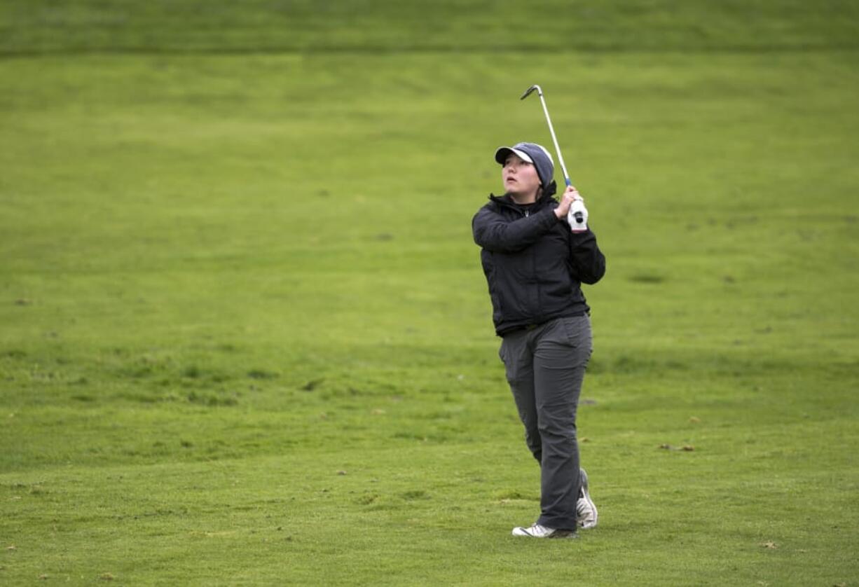 Washougal’s Kallie Sakamoto watches her hit on the 8th hole during the Chieftain Invitational at Tri-Mountain Golf Course in Ridgefield on Thursday April 12, 2018.