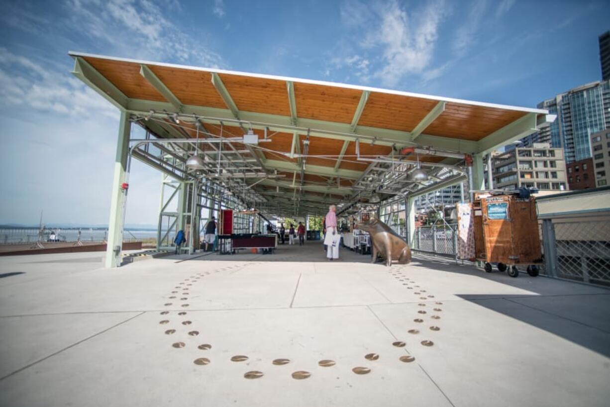 Inside the new MarketFront Pavilion at Seattle’s Pike Place Market, artists and farmers sell their wares away from the busy hallways of the historic indoor market.