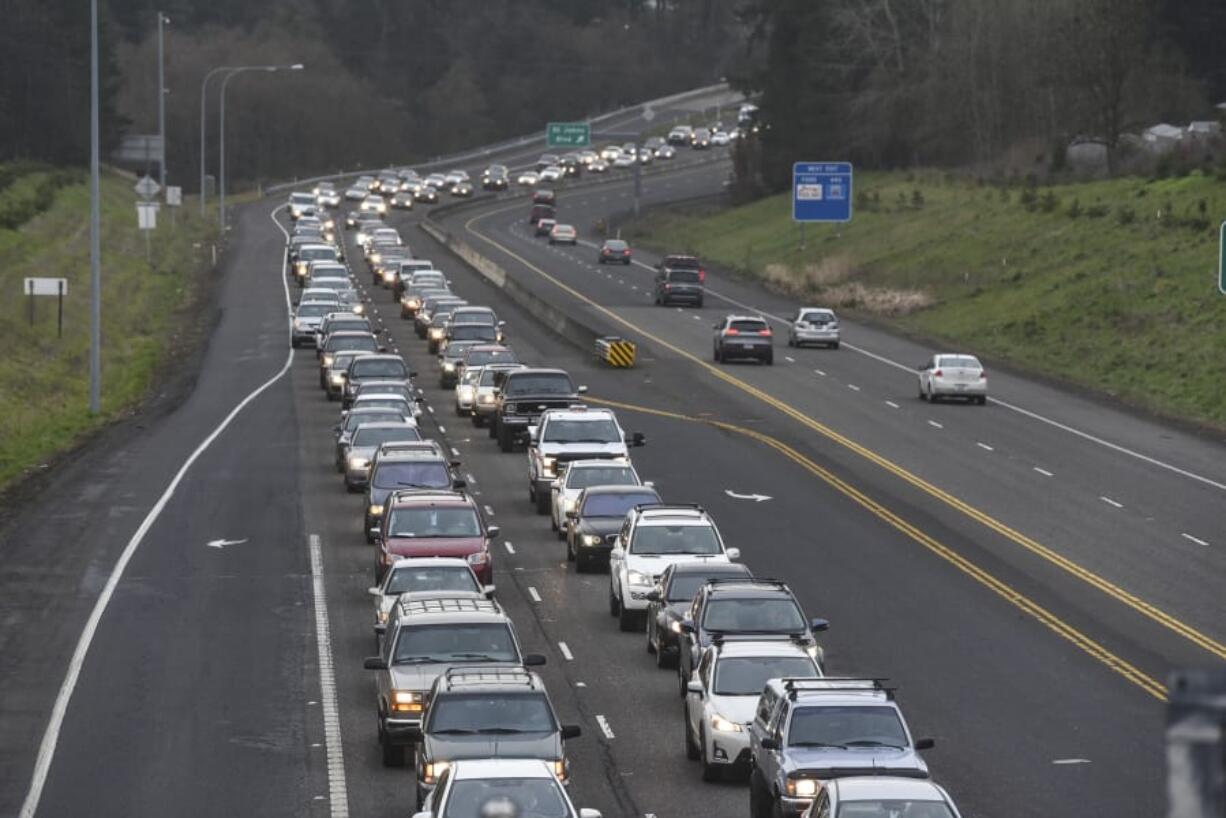 Vehicles traveling east on state Highway 500 wait at the stoplight at Falk Road road during rush hour in late February. WSDOT is considering three alternatives to change the intersection to improve safety and travel times in the corridor. The agency is hosting an open house May 3 to get the public’s feedback on the concepts.