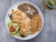 The shrimp-stuffed chile relleno comes with a zesty chipotle sauce, cheese, beans and Spanish rice.