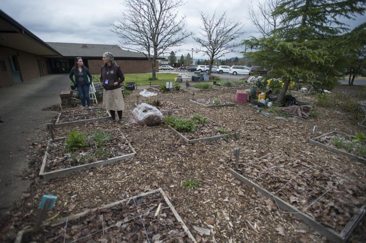 At River HomeLink, students can take a gardening elective or directly apply math and science in an area that was once a patch of grass. Zorah Oppenheimer of the Clark Conservation District, left, and Kris Potter of River HomeLink chat about the work that went into the project.