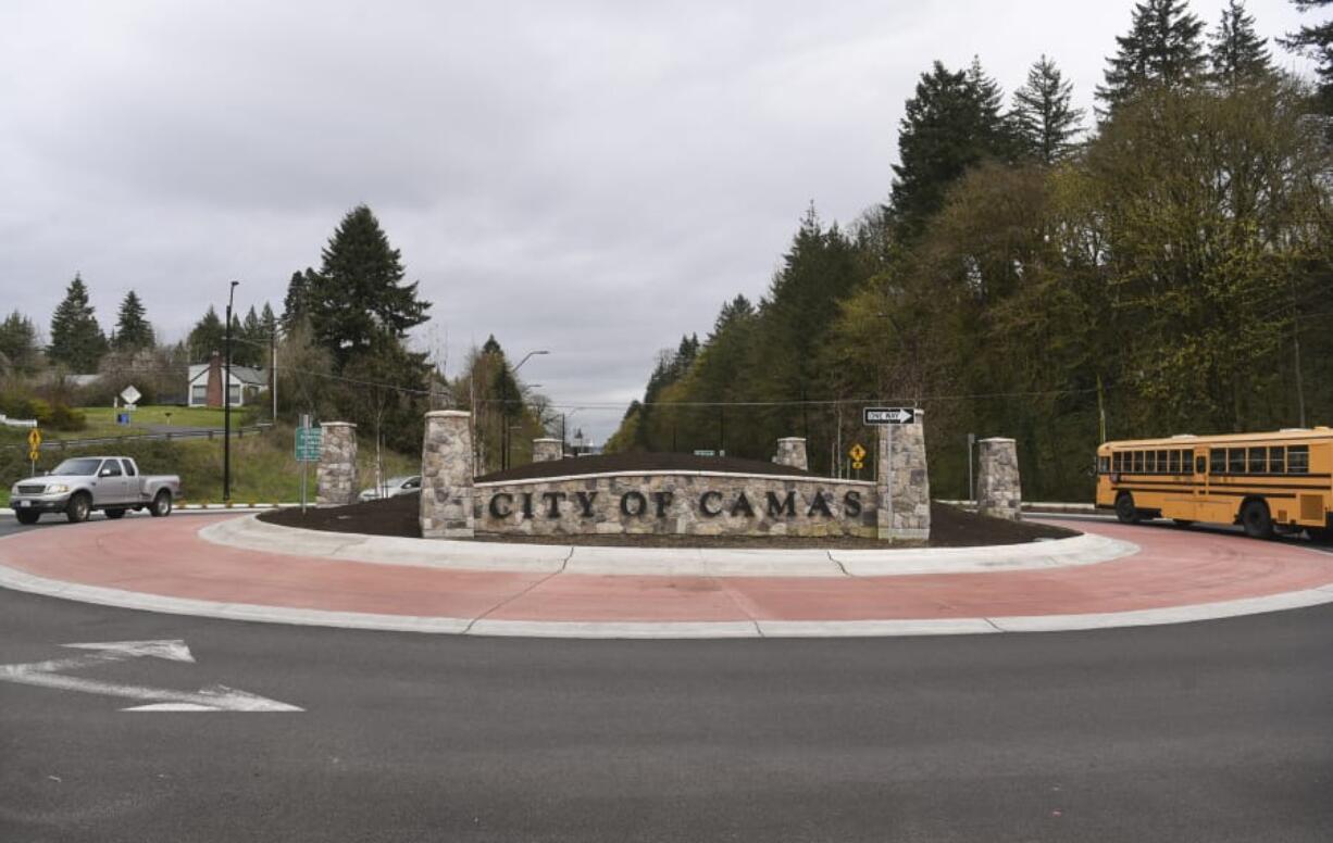 Traffic flows around the roundabout on Northwest Sixth Street near Highway 14. Drivers initially resisted a roundabout at the main entrance to the city but have since adapted to it.