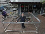 Daren Morgan, owner of Top Shelf Martinis on Main, pauses for a portrait in his outdoor patio space in downtown Vancouver. The city of Vancouver has told Morgan it won’t renew permits for the patio unless it is reconfigured.