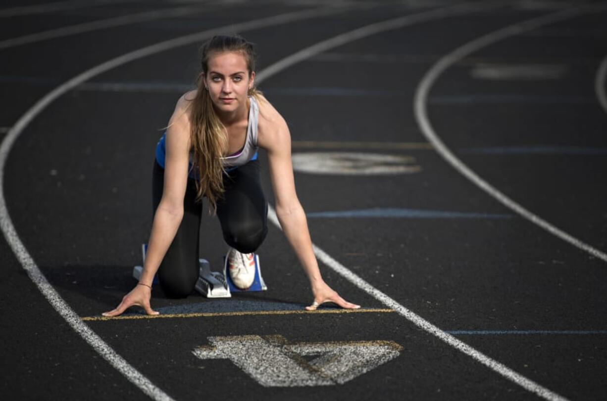 Chloe Lindbo, a Ridgefield High School graduate and Clark College sophomore, is pictured during practice in Vancouver Monday morning, April 9, 2018.