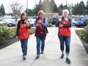 East Vancouver: The Golden Girls, from left, Penny Ruthruff, Kathie Malone and Amanda Sobotta, are three volunteers at the Humane Society of Southwest Washington. The society honored its volunteers at an event in February.