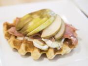 The Second Breakfast waffle, topped with prosciutto ham, brie and organic pear.