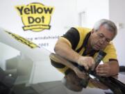 Steve Harmon, owner of Yellow Dot Windshield Repair, prepares a chip for repair at his shop in Vancouver on Wednesday afternoon. Harmon started his business in 2003 and spent many years at Vancouver Mall. He recently relocated to his own shop on East 18th Street.