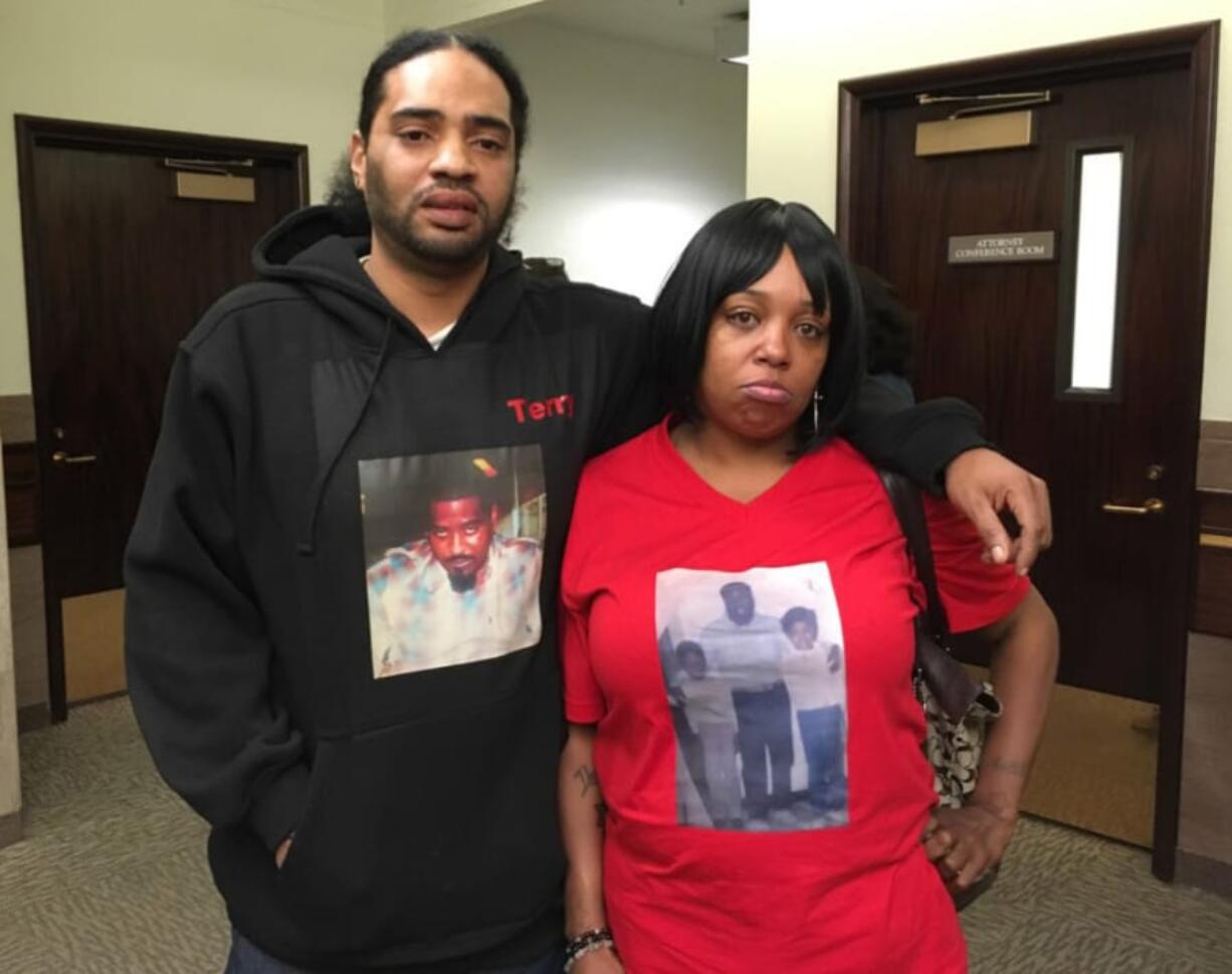 Terry and Anell Collins wear clothing featuring photos of their brother, 37-year-old Allen Collins, who was killed by Arkangel Howard in March 2017 at an east Vancouver apartment complex. The Collins attended what was supposed to be Howard's sentencing on Friday, but it was postponed another week. The siblings decided to offer their comments to the court despite the delay.