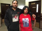 Terry and Anell Collins wear clothing featuring photos of their brother, 37-year-old Allen Collins, who was killed by Arkangel Howard in March 2017 at an east Vancouver apartment complex. The Collins attended what was supposed to be Howard's sentencing on Friday, but it was postponed another week. The siblings decided to offer their comments to the court despite the delay.