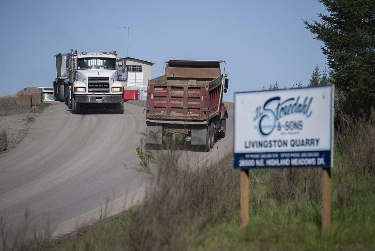 Trucks come and go from the quarry on Livingston Mountain.