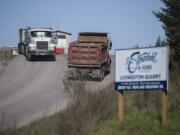 Trucks come and go from the quarry on Livingston Mountain.