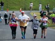 Blooms to Brews relay runners really get into the spirit.