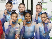 Vancouver's Jordan Chiles (front row, center) and her United States teammates won the team gold medal at the Pacific Rim Championships on Sunday at Medellin, Colombia.