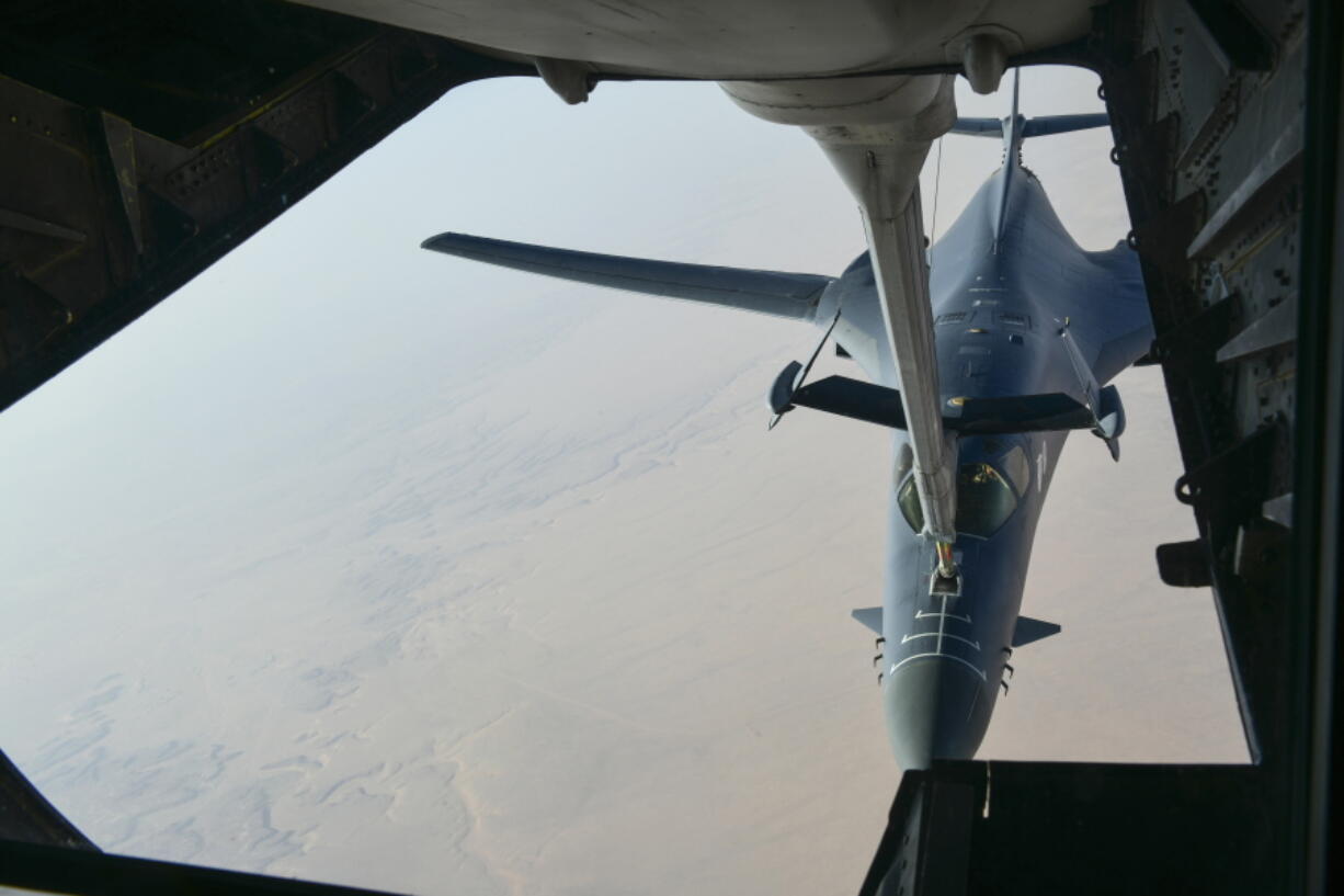 In this image released by the Department of Defense, a U.S. Air Force B-1 Bomber separates from the boom pod after receiving fuel from an Air Force KC-135 Stratotanker on April 13, 2018, en route to strike chemical weapons targets in Syria. President Donald Trump declared “Mission Accomplished” for a U.S.-led allied missile attack on Syria’s chemical weapons program, but the Pentagon said the pummeling of three chemical-related facilities left enough others intact to enable the Assad government to use banned weapons against civilians if it chooses.