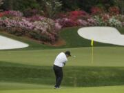 Patrick Reed hits to the 13th green during the second round at the Masters golf tournament Friday, April 6, 2018, in Augusta, Ga.