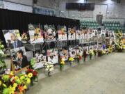 Photos of people involved in a fatal bus crash are seen prior to a vigil at the Elgar Petersen Arena, home of the Humboldt Broncos, in Humboldt, Saskatchewan on Sunday, April 8, 2018.