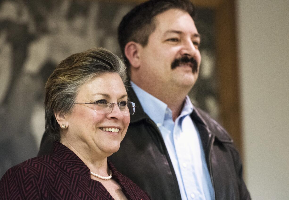 FILE - In this Feb. 8, 2018, file photo, school teacher Cathy Myers, left, and union iron worker Randy Bryce, two Democratic primary candidates in the race for Wisconsin's 1st Congressional District, pose for a photo at the United Automobile Workers building in Janesville. Both are running to fill the seat of House Speaker Paul Ryan, R-Wis., who announced Wednesday, April 11, 2018, he was not running for re-election.