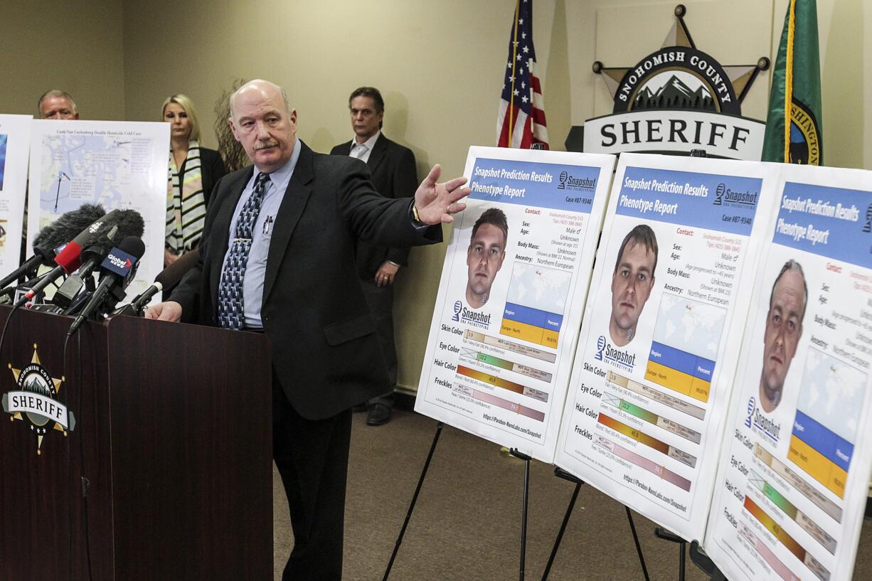 Snohomish County Cold Case Detective Jim Scharf, left, presents new images rendered using phenotype technology of a potential suspect in the unsolved case of the 1987 double homicide of Jay Cook and Tanya Van Cuylenborg during a press conference in Everett, Washington on Wednesday, April 11, 2018.