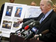 Snohomish County Cold Case Detective Jim Scharf, right, shares details of the unsolved case of the 1987 double homicide of Jay Cook and Tanya Van Cuylenborg, during a press conference in Everett, Washington on Wednesday, April 11, 2018.