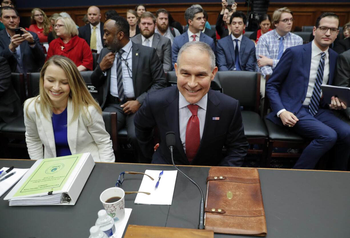 Environmental Protection Agency Administrator Scott Pruitt takes his seat as he arrives to testify before the House Energy and Commerce subcommittee hearing on Capitol Hill in Washington, Thursday, April 26, 2018. Sitting next to Pruitt is Holly Greaves, EPA's Chief Financial Officer.