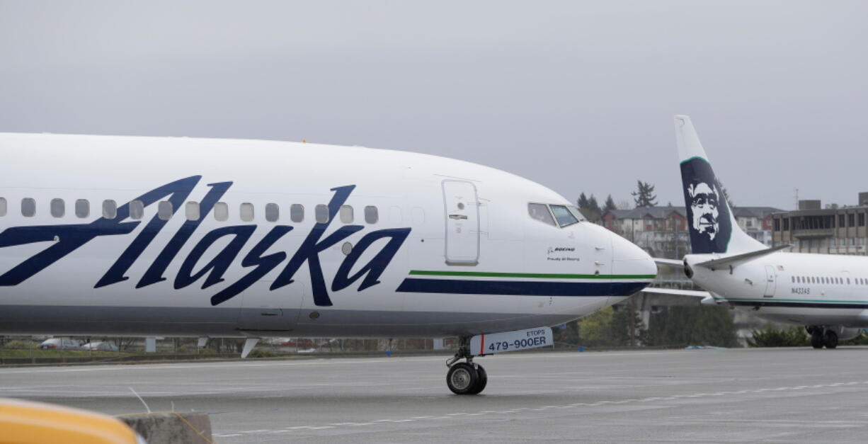 An Alaska Airlines plane taxis Friday at the Seattle-Tacoma International Airport in Seattle. Ted S.