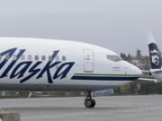 An Alaska Airlines plane taxis Friday at the Seattle-Tacoma International Airport in Seattle. Ted S.