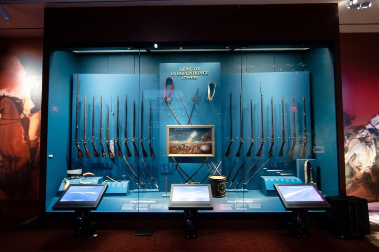 FILE - This April 4, 2017, file photo shows a display of weapons used during the Revolutionary War, including a fife and drum, at the Museum of the American Revolution in Philadelphia. The museum, which celebrates its first anniversary on April 19, has met expectations and it is in a healthy financial position.