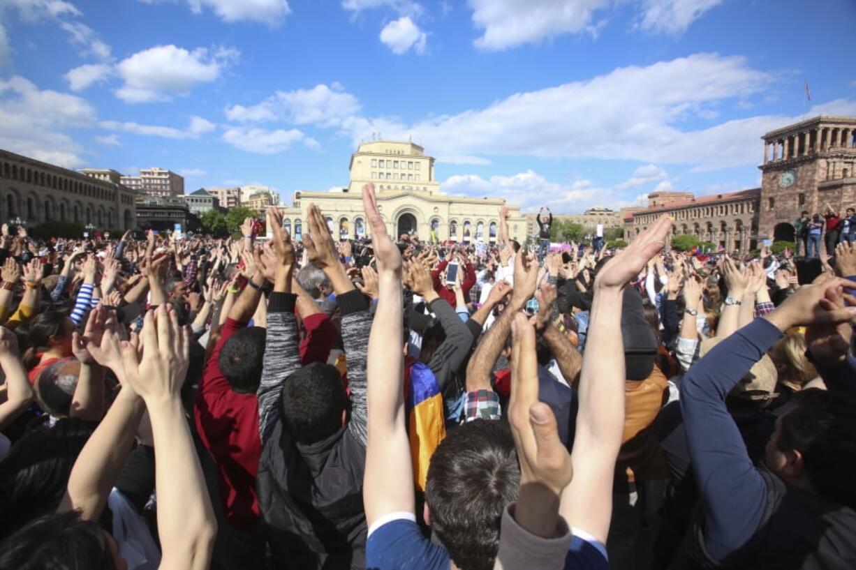 People celebrate Armenian Prime Minister’s Serzh Sargsyan’s resignation in Republic Square in Yerevan, Armenia, on Monday. Sargsyan resigned unexpectedly on Monday, an apparent move to bring to an end massive anti-government protests.