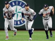 Houston Astros outfielders Josh Reddick, left, George Springer and Jake Marisnick celebrate victories this season by doing dances inspired by the Fortnite Battle Royale video game.