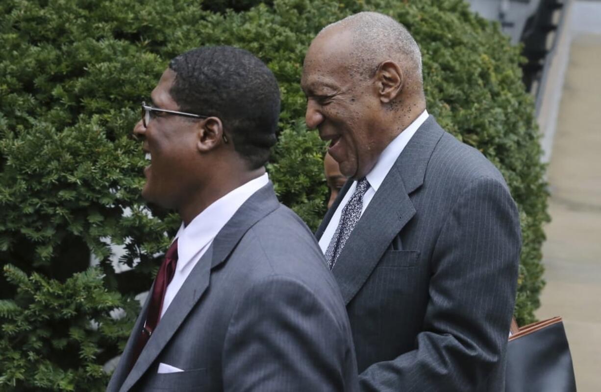 Bill Cosby, right, is escorted by spokesperson Andrew Wyatt, as they leave hearings for jury selection in Cosby’s sexual assault retrial Tuesday at the Montgomery County Courthouse in Norristown, Pa.