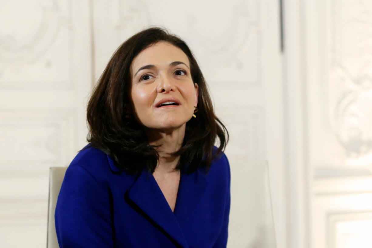 FILE - IN this Jan. 22, 2018 file photo, Operating Officer of Facebook, Sheryl Sandberg attends a meeting with France’s President Emmanuel Macron, during the “Choose France” summit, at the Chateau de Versailles, outside Paris. Sandberg says Facebook should have conducted an audit after learning that a political consultancy’s improperly accessed user data nearly three years ago. The company’s chief operating officer told NBC’s Today show, Friday, April 6, that Facebook is now undertaking that audit.