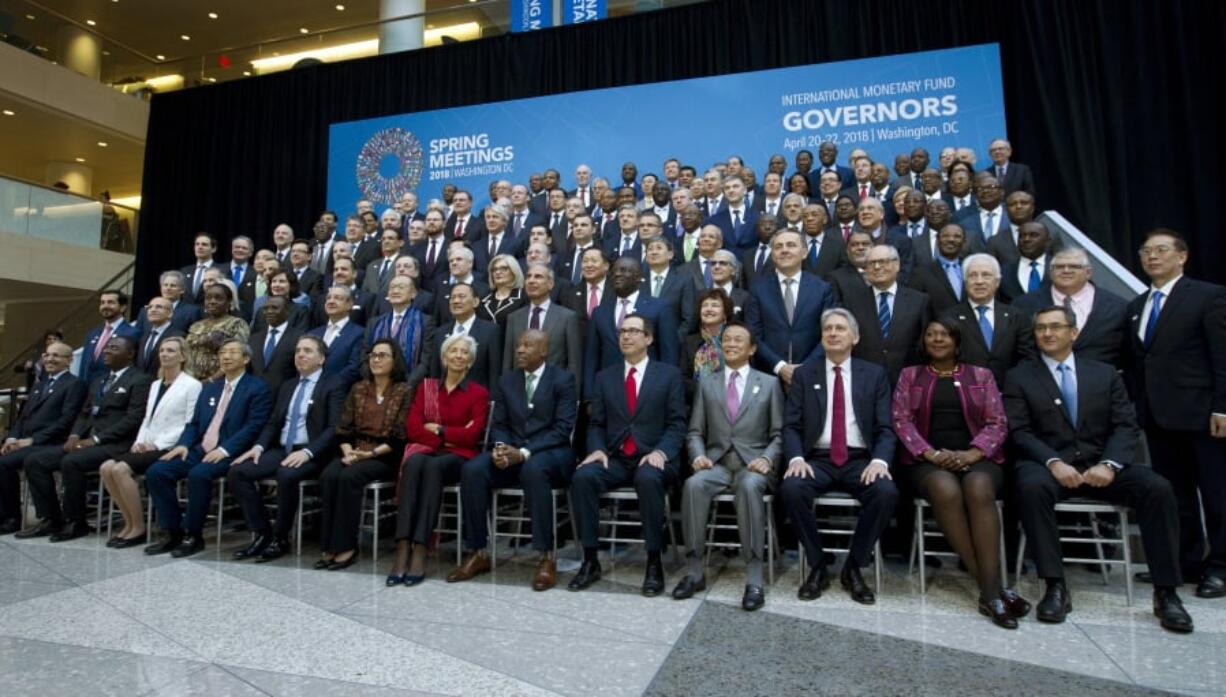 International Monetary Fund (IMF) Governors gather for a group photo during World Bank/IMF Spring Meetings in Washington, Saturday, April 21, 2018.