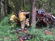 Firefighters with Clark County Fire & Rescue had to carefully remove a man who was pinned in his car after veering off I-5 and crashing into a tree.