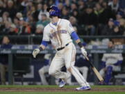 Seattle Mariners’ Mitch Haniger watches his two-run home run against the Cleveland Indians during the seventh inning of a baseball game Sunday, April 1, 2018, in Seattle. (AP Photo/Ted S.