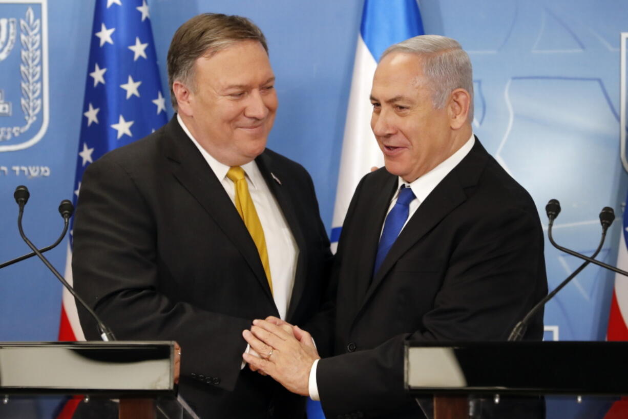 U.S. Secretary of State Mike Pompeo. left. is greeted by Israeli Prime Minister Benjamin Netanyahu ahead of a press conference at the Ministry of Defense in Tel Aviv, Sunday, April 29, 2018.