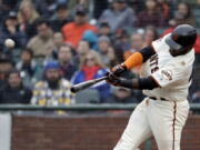 San Francisco Giants' Pablo Sandoval hits a three-run home run against the Seattle Mariners during the fifth inning of a baseball game Wednesday, April 4, 2018, in San Francisco.