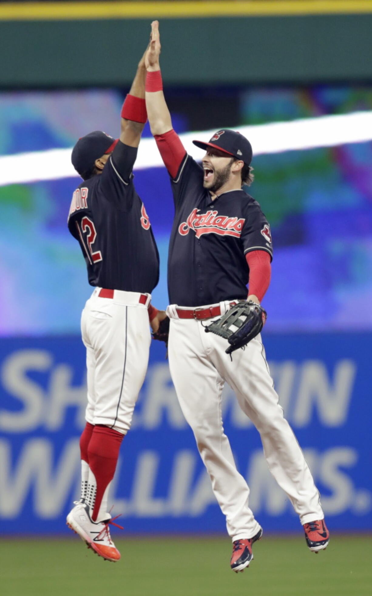 Cleveland Indians’ Francisco Lindor, left, and Tyler Naquin celebrate after the Indians defeated the Seattle Mariners 6-5 in a baseball game Friday, April 27, 2018, in Cleveland.