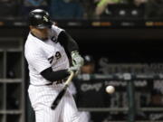 Chicago White Sox’s Jose Abreu hits a home run off Seattle Mariners relief pitcher Wade LeBlanc during the sixth inning of a baseball game Monday, April 23, 2018, in Chicago.