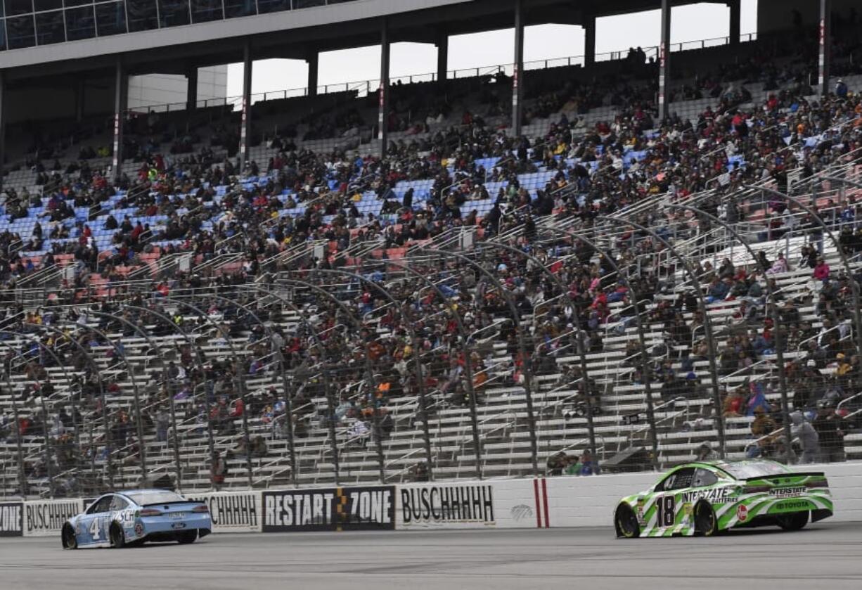 Kevin Harvick (4) and Kyle Busch (18) during a NASCAR Cup Series race in Fort Worth, Texas. Recently, the spotlight has been more on controversies than the racing itself.