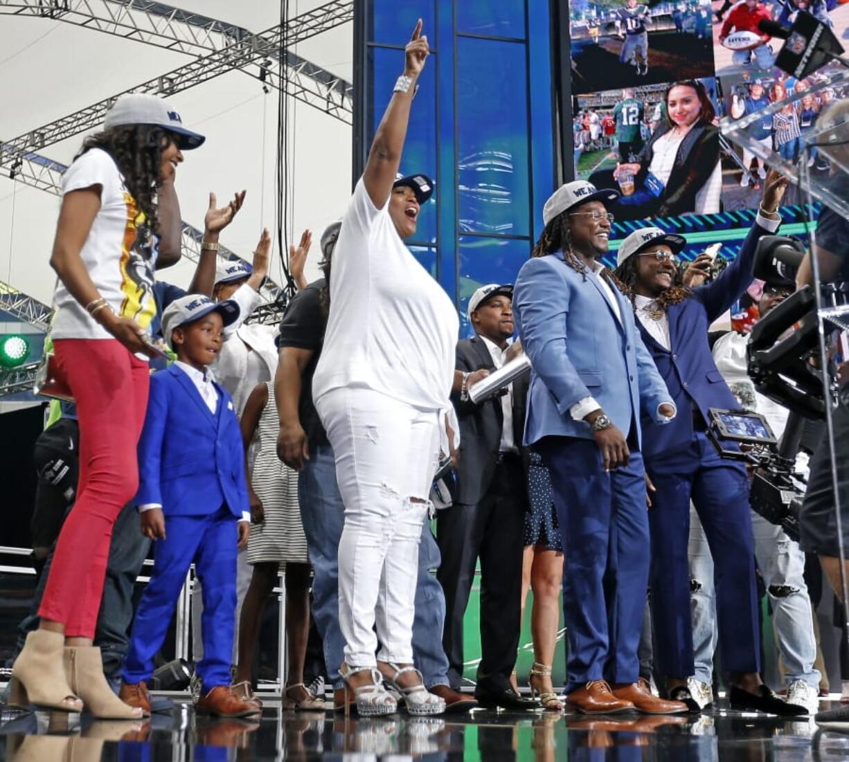 The family members of Shaquem Griffin take the stage during the NFL football draft in Arlington, Texas, Saturday, April 28, 2018. The Seahawks selected Shaquem in the fourth round. (Jae S.