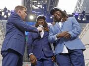 NFL Network’s Scott Hanson, left, talks with Seattle Seahawks cornerback Shaquill Griffin, center, and Shaquem Griffin on stage during the NFL football draft in Arlington, Texas, Saturday, April 28, 2018. The Seahawks selected Shaquem in the fourth round. (Jae S.