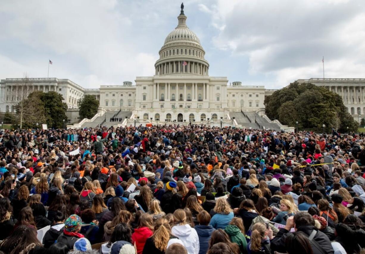 FILE- In this March 14, 2018, file photo, students rally outside the Capitol Building in Washington. Students risked disciplinary action at nearly 3,000 high schools in the first nationwide walkout for gun policy reform in March. According to a database maintained by the National Association for College Admission Counseling, hundreds of colleges nationwide have expressed support for student activists on Twitter and their websites.